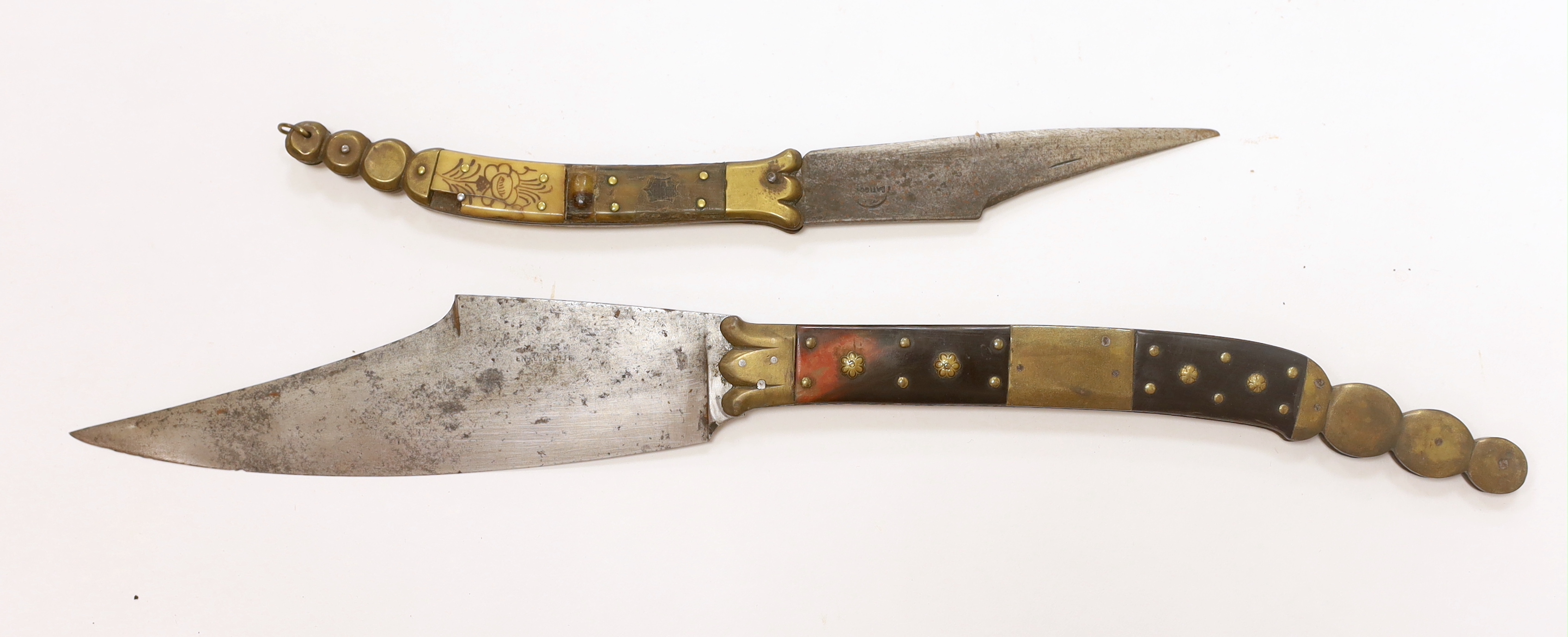 A good Spanish folding knife Navaja, horn and brass handle, the blade of conventional form, 19.3cm, and another similar smaller knife